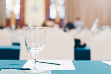 Drinkking water in wine glass on table of meeting room