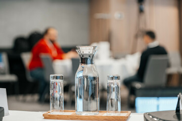 glass of water on the conference table