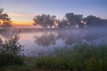 Fototapeta na wymiar august sunrise over the river