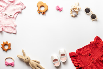 Fototapeta na wymiar Set of baby girl dress and accessories, top view. Kids wear flat lay