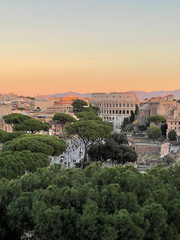 Fototapeta na wymiar Spectacular sunset view of Rome and Colosseum, blending ancient charm with modern allure.