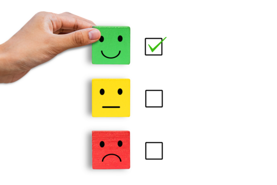 hand holding emotion face symbol on Green, yellow and red wooden blocks, Consumers Show Satisfaction Rating concept by evaluating business success. Services and products and Customer Engagement.