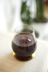 black drip coffee in glass cup