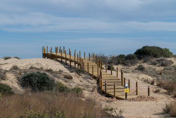 Elevated boardwalk under construction in the Carabassi beach, province of Alicante, Spain