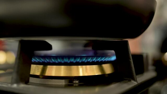 close up of a stove lighting up 
