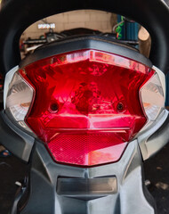 The motorcycle parts. the modern red brake light cover seen from behind