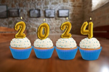 Cupcakes with 2024 number candles for  New Year