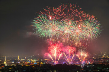 Beautiful fireworks and iconic Bangkok landmarks are illuminated during the Vijit Chao Phraya. (Lighten blending mode 2 layers)