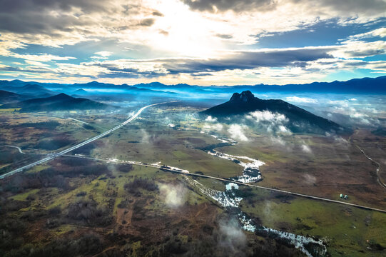 Lika region. Zir hill and Velebit mountain in Lika landscape morning dramatic view. A1 highway.