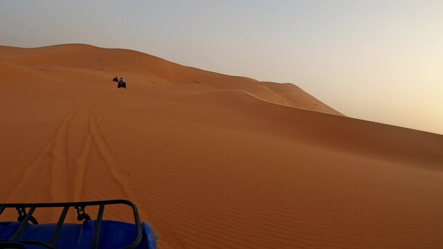 Quads on a sunset in the desert of Merzouga