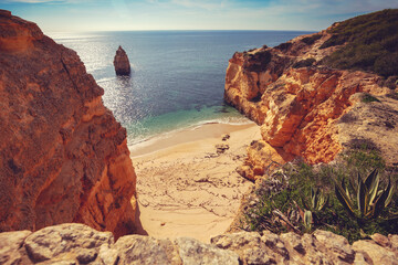 Coastal rocky seascape. View of Praia da Marinha beach in Algarve region, Atlantic ocean, Portugal, Europe