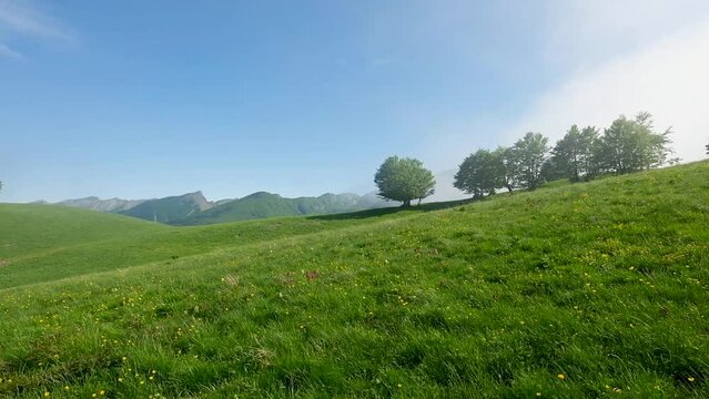 Fast moving clouds over a hill in the Parco dei Mille Laghi located in the Italian region of Emilia Romagna.
