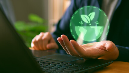 Net zero and carbon neutral concept, businessman hold virtual green globe with net zero icon....