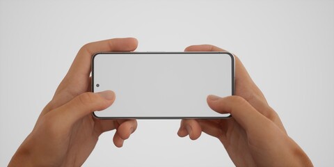 Caucasian male playing a game on his phone against white background
