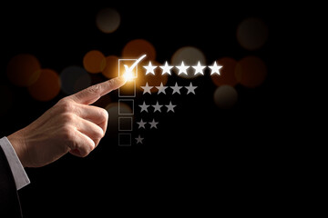 Businessman hand  give five star symbol to increase rating of products and service on the virtual touch screen, Customer service and business satisfaction survey.