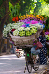 Mobile flower store on bicycle is an iconic image of Ha Noi in autumn annually