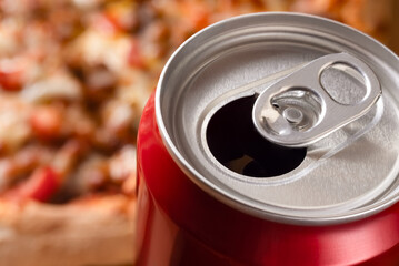 soda can at pizza background. fastfood concept.