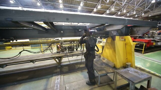 Welder works in Tver Railway Carriage Plant. 
