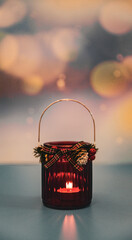 Glass jar candle on a colorful background with bokeh.