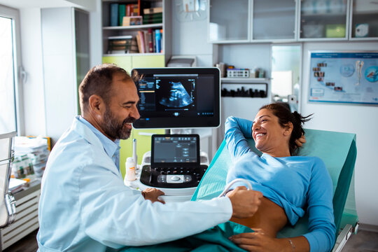 Expectant Mother Having Ultrasound with Doctor in Clinic