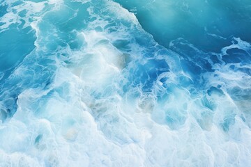 Stunning aerial top view background image of ocean sea water, white waves splashing in the deep sea.