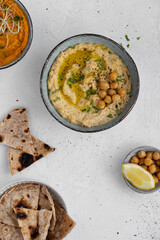 Traditional hummus from chickpea. Spread. Assorted meze and dips with crispy pita. Middle eastern...