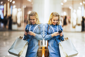 Shopping Woman Texting On Her Cell Phone