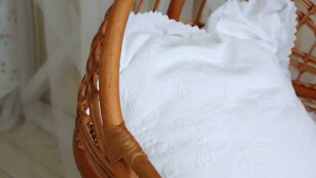 Big basket with laundry for a small child in light studio