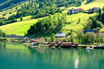 Naklejka premium Red traditional buildings on the water front