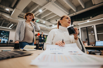 Business team collaborating on financial growth and market analysis in a pleasant office atmosphere.