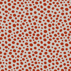 Abstract vector seamless pattern with red circles. Simple geometric round shapes repeated design on gray background. Modern polka dot ornament for fashion, home decor, wrapping paper, textile