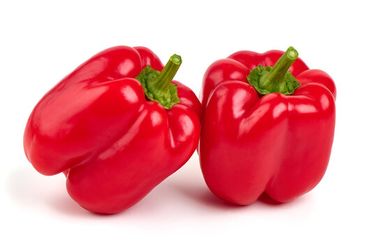 Red ripe bell peppers, isolated on white background.