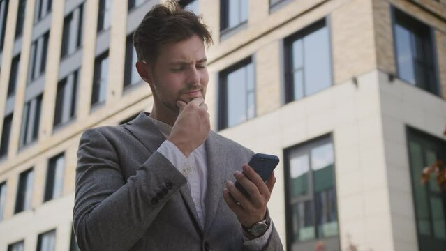 Businessman Using Smartphone in the City