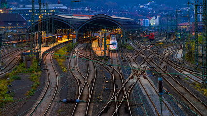 Main station wide angle panorama with tracks, platforms, signals an passenger trains in Hagen,...