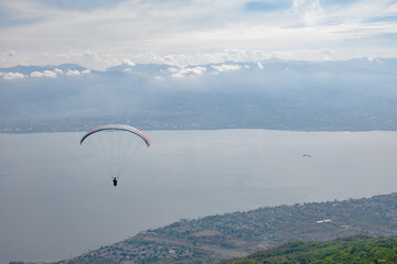 Paragliding soars at salena peak, palu city, Central sulawesi.