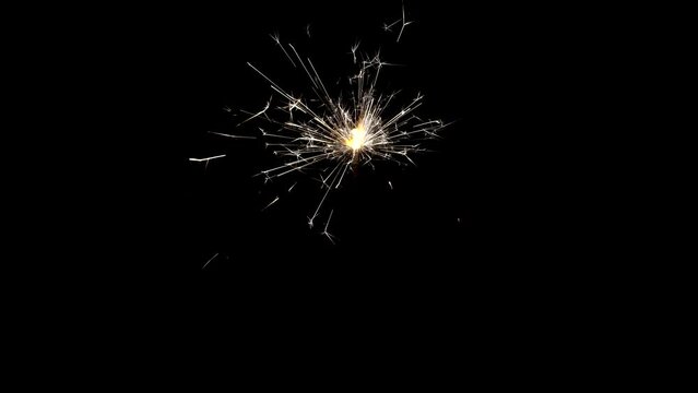 Bright Christmas sparklers on a black background