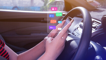 Woman using social media and digital online marketing concepts on mobile phones with icons such as notifications, messages, comments on the smartphone screen in a car.