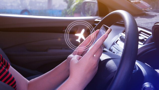 Uses touching to select flight by pressing touch screen airplane button on smartphone, Business Airplane transportation concept.