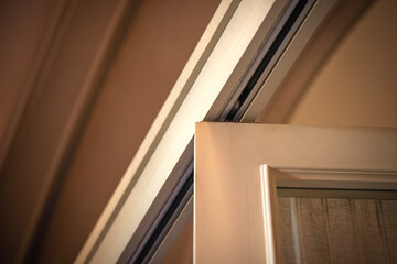 Close-up of the top track of a large sliding sectional door.