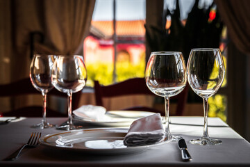 Served dining table by the window in a luxury restaurant.
