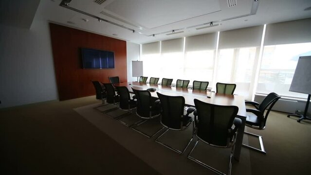 Turning off lights in stylish room for business meetings