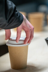 hands of a person with a cup