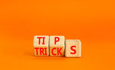Tips and tricks symbol. Turned wooden cubes and changed the word tricks to tips. Beautiful orange...