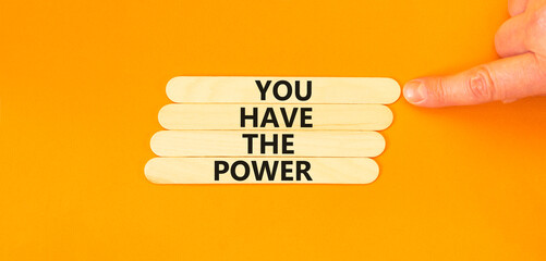 You have the power symbol. Concept word You have the power on beautiful wooden stick. Beautiful orange table background. Businessman hand. Business motivational you have the power concept. Copy space.
