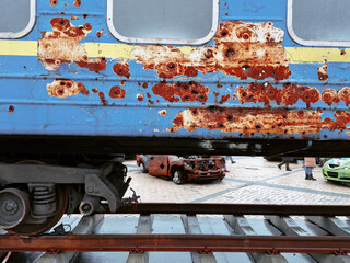 The marks of bullets and shrapnel on train carriages left after the war in Ukraine.