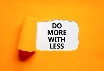 Do more with less symbol. Concept word Do more with less on beautiful white paper. Beautiful orange...