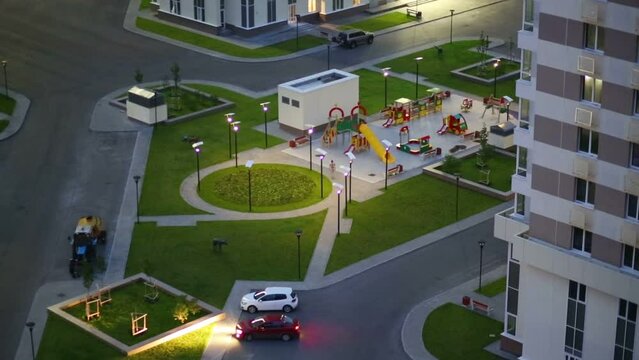 Top view of parking and playground of residential complex
