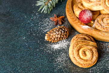 Obraz na płótnie Canvas Snail cookies. Homemade baking. Cookies for the holiday. New Year's decor. Copy space. Flat lay