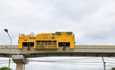 The Modern Yellow rails maintaining machine car stand by for making maintenance the rail of monorail system, Bangkok Thailand. 