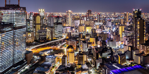 Osaka big city lights from above skyline with skyscraper panorama at twilight in Japan